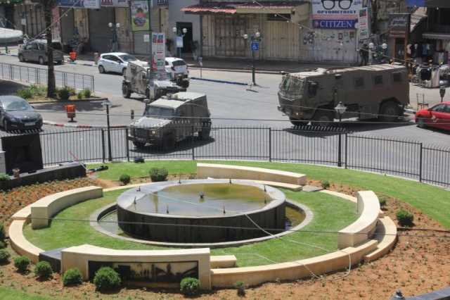 الاحتلال يعتقل 20 فلسطينيا ويهدم محلات ومنشآت بالضفة