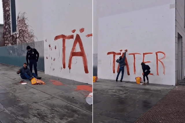 ناشطان يكتبان جناة على واجهة المستشارية الألمانية