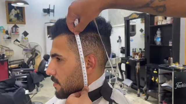 30 سنتا لكل سنتيمتر تسعيرة حلاقة بكربلاء.. كيف تلقاها العراقيون؟
