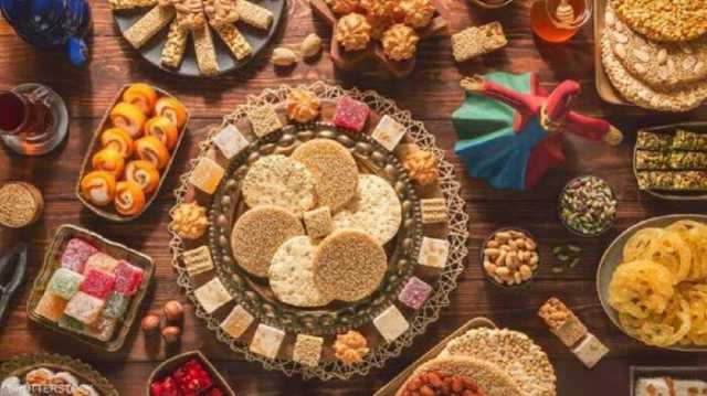 هل التهادي بحلوى المولد النبوي بدعة؟.. الإفتاء تُجيب
