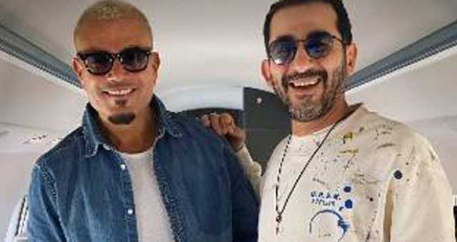 “الألوان جت كده صدفة”.. كواليس لقاء أحمد حلمي وعمرو دياب في الطائرة