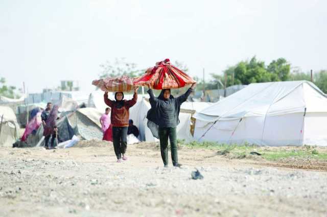 تحت المطر والنار.. يوم فلسطيني ثقيل من المعاناة والانتظار