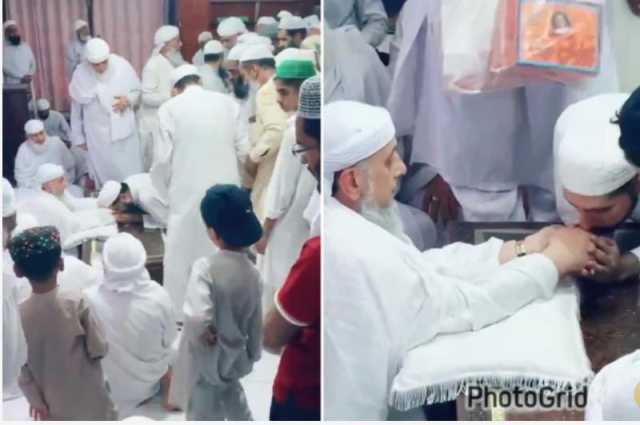 شاهد.. رجل دين يجمع أموال وهدايا مقابل تقبيل يده للتبرك بها في إحدى الدول الآسيوية